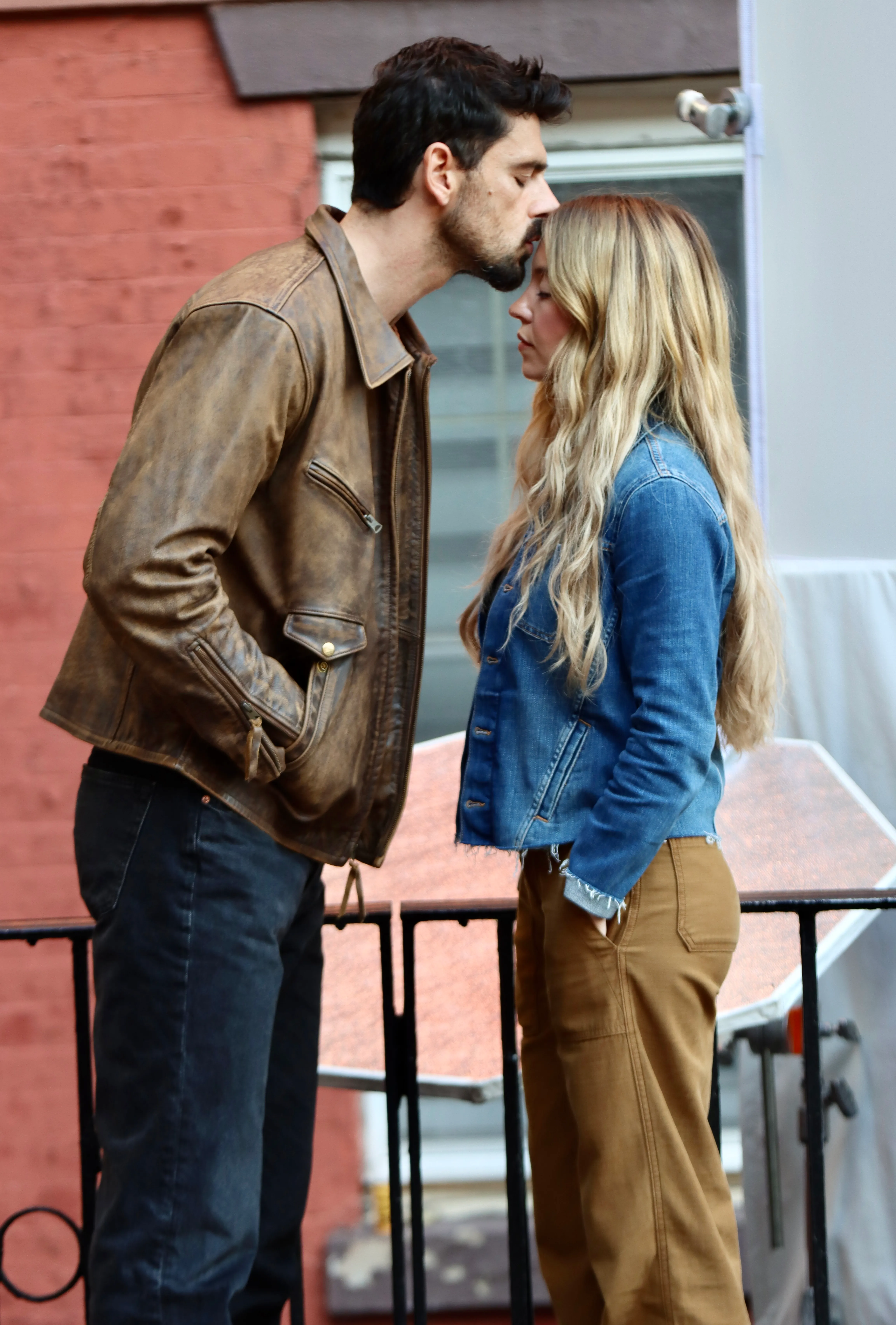 Michele Morrone kisses Sydney Sweeney on the forehead on the film set of 