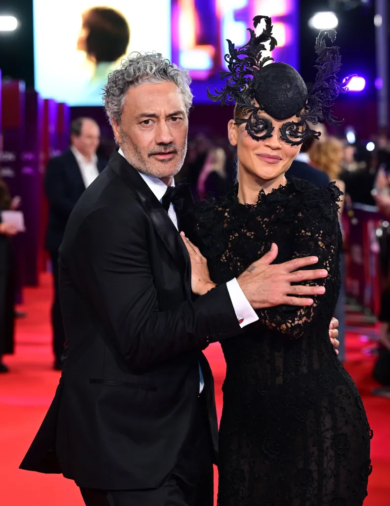 Taika Waititi and Rita Ora on the red carpet at a film premiere.