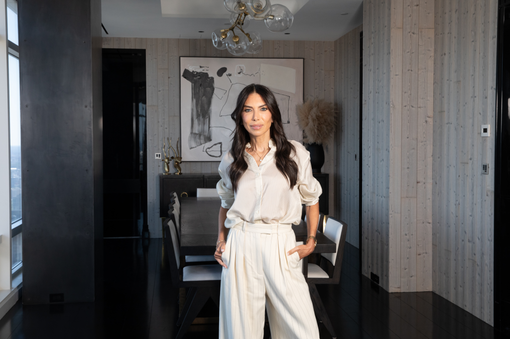 Tanya Zuckerbrot stands in her Midtown apartment.