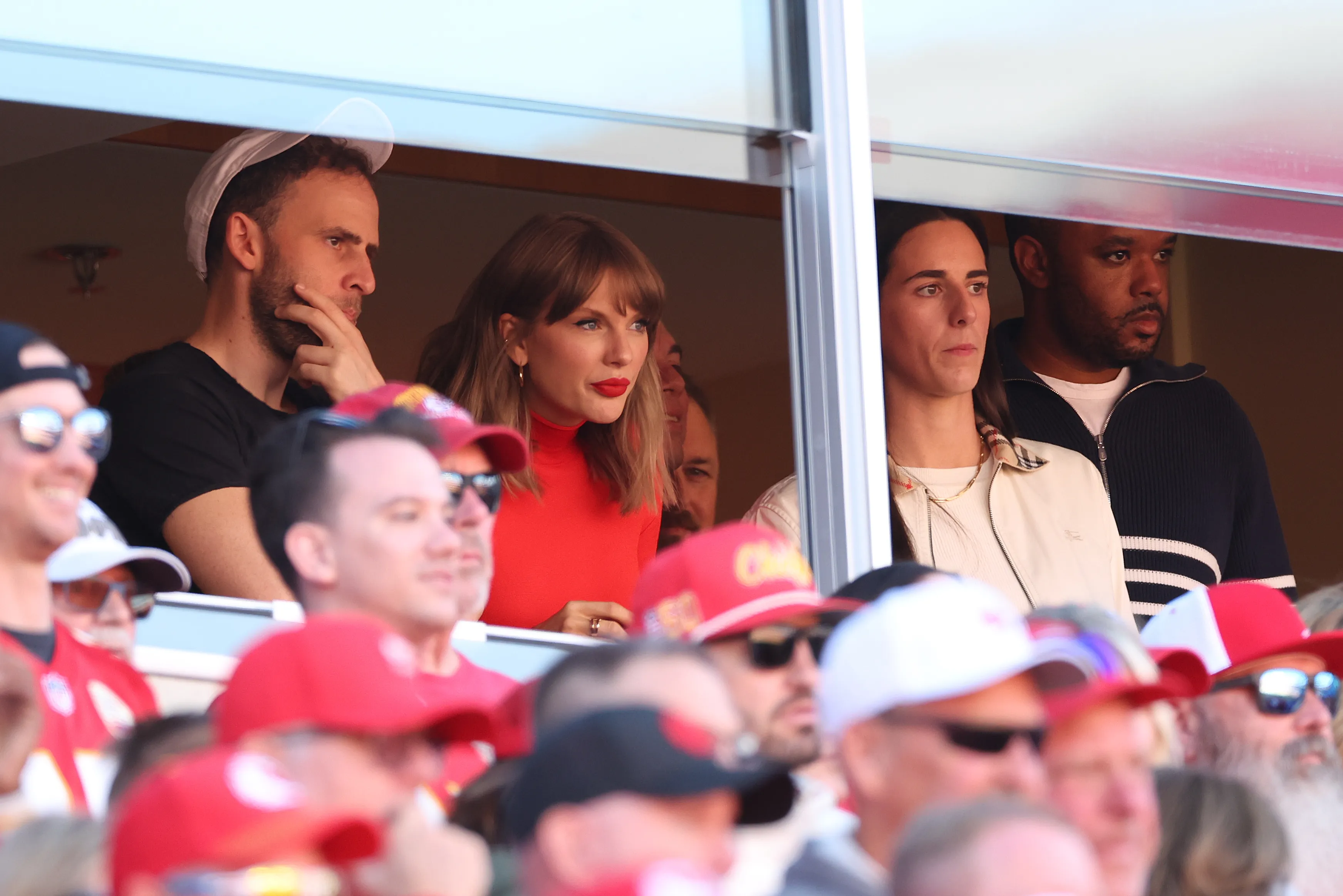 Taylor Swift and Caitlin Clark watch a game from a suite.