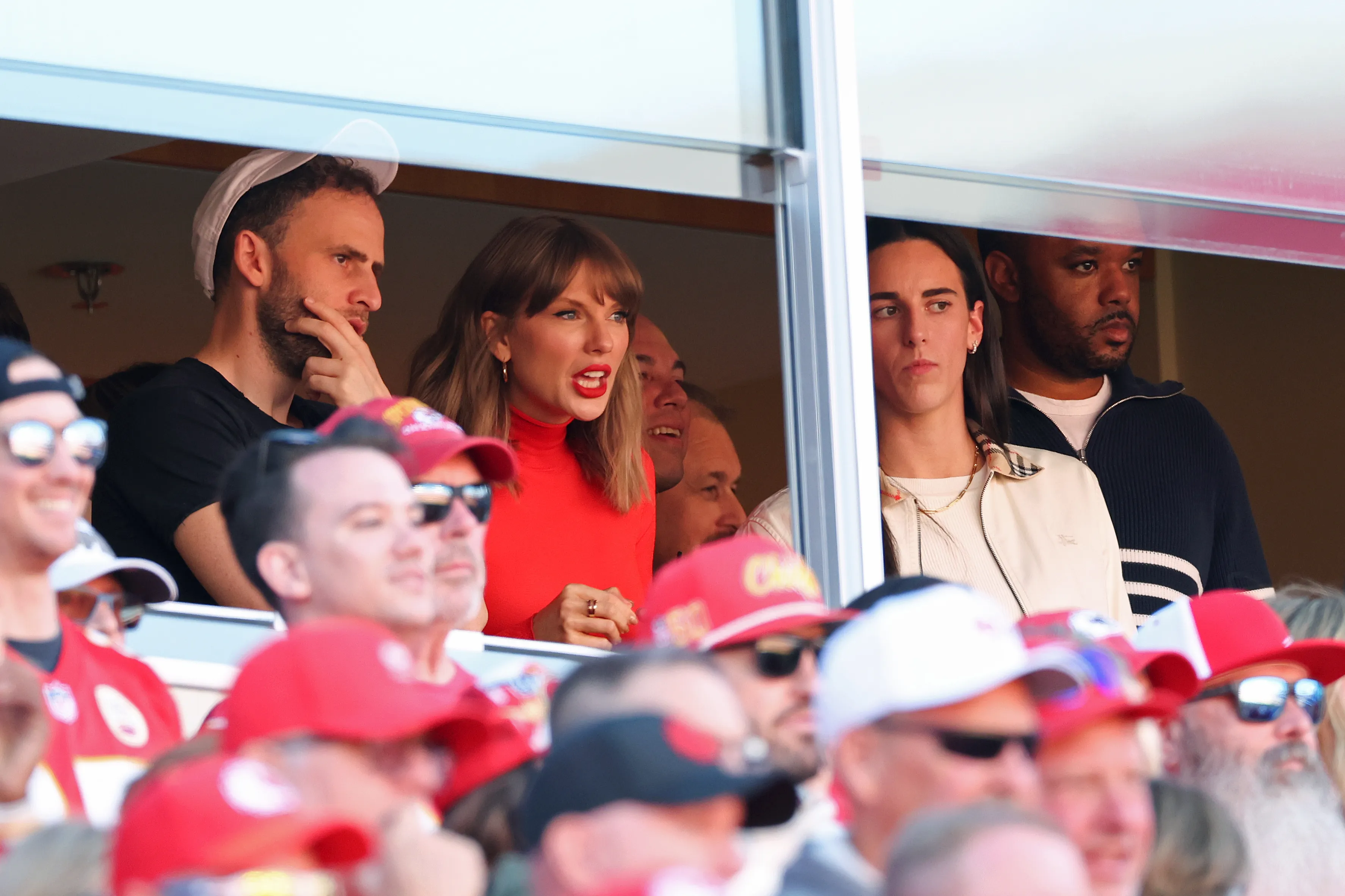 Taylor Swift and Caitlin Clark watch a game between the Kansas City Chiefs and the Los Angeles Chargers from a luxury box.