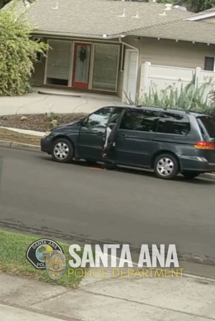 A black minivan parked on a street in front of a house, identified by Santa Ana Police Department detectives using ALPR technology in connection with an animal abandonment case.