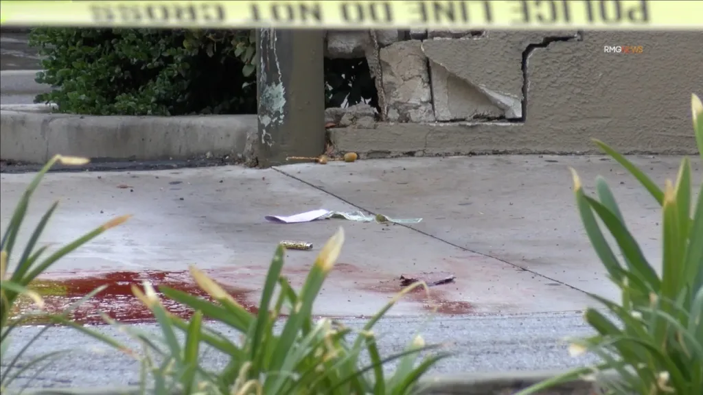 A crime scene investigation area in Arcadia, California, featuring police tape and blood on the pavement.
