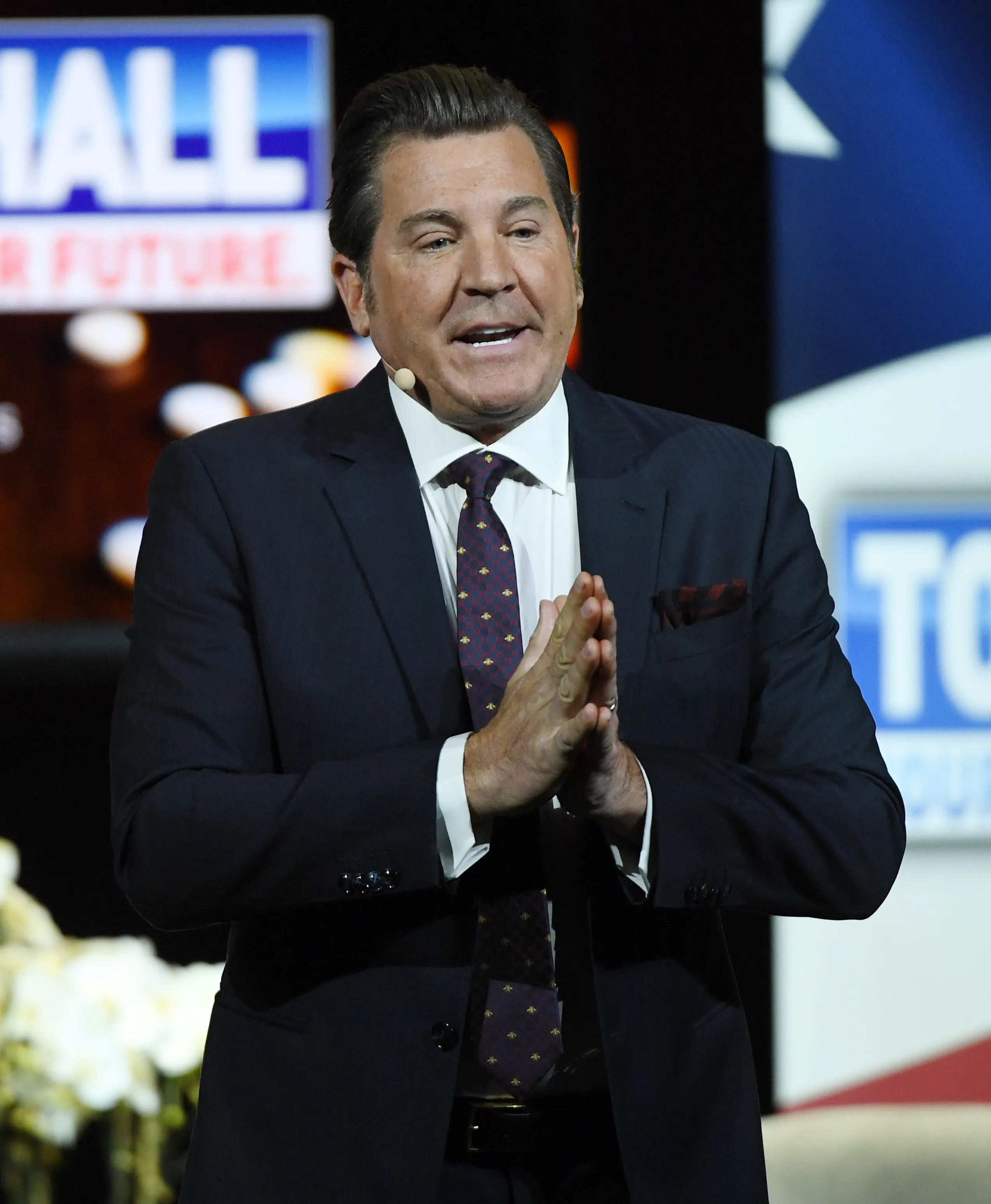 Television personality Eric Bolling speaks at a town hall meeting.