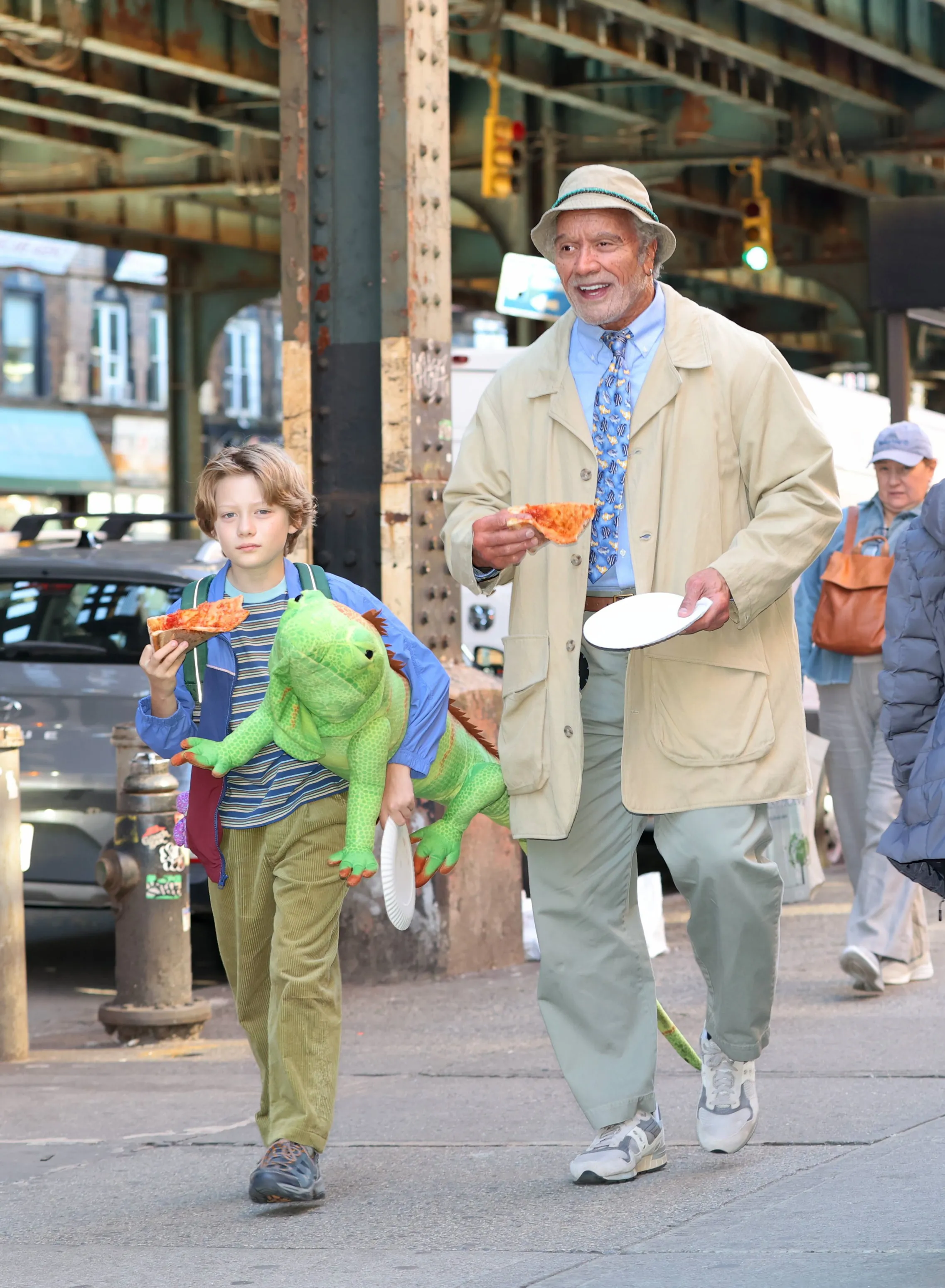 Theo Leber and Dwayne Johnson eating pizza while filming 