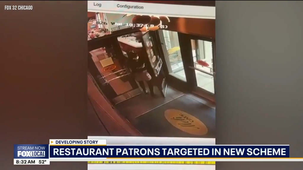 Surveillance footage shows a person entering a restaurant doorway.
