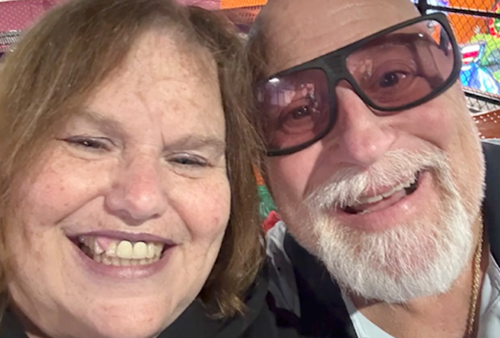 A close-up selfie of a smiling couple.