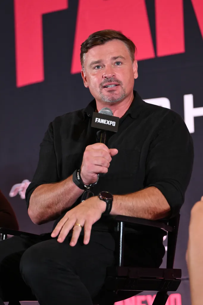 Tom Welling speaking on stage during FanExpo Chicago.