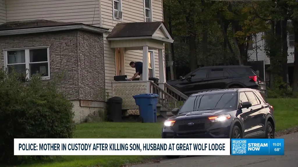 Pocono Township Police cars parked outside a house in Towanda, Pennsylvania, as officers search the property.