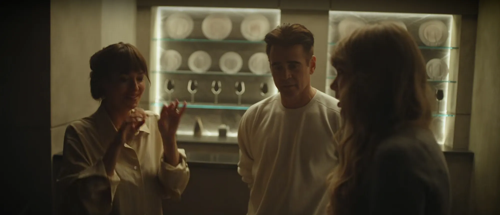 Taylor Swift directs a scene with actors on set.