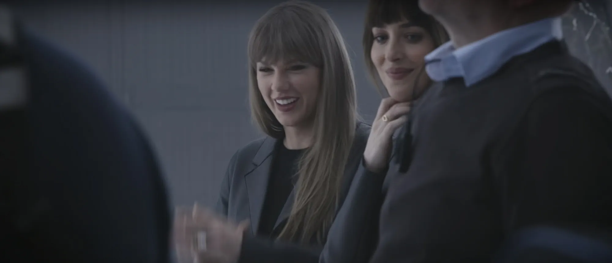 Taylor Swift and Dakota Johnson on the set of a music video.