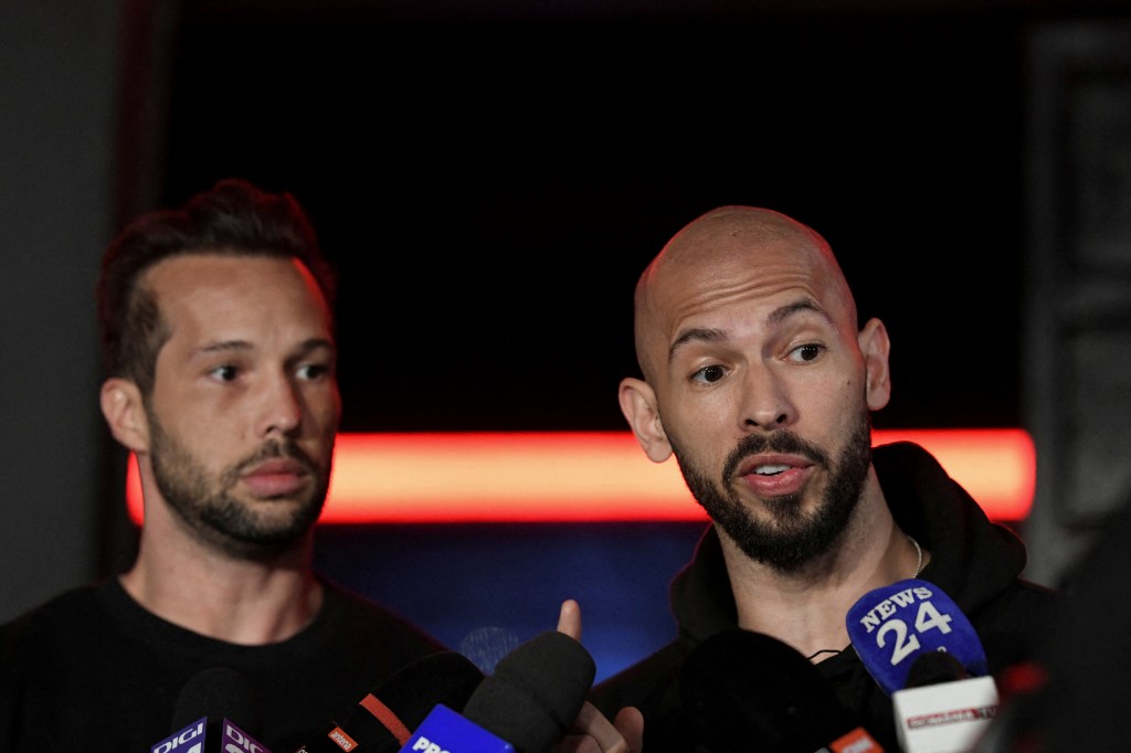 Tristan and Andrew Tate deliver a press statement in front of their house near Bucharest, Romania.