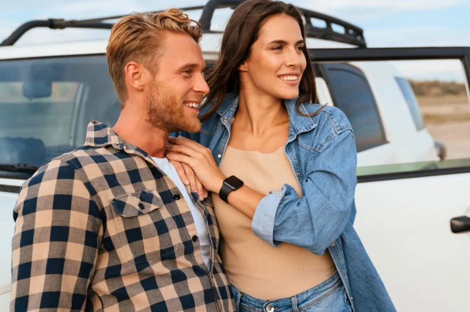 man and women by car