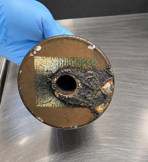 A spent M18 smoke grenade discovered in a passenger's carry-on bag at Watertown International Airport.