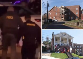 Cops raid West Virginia University frat houses in hazing probe, hauling out bags as hundreds of students look on