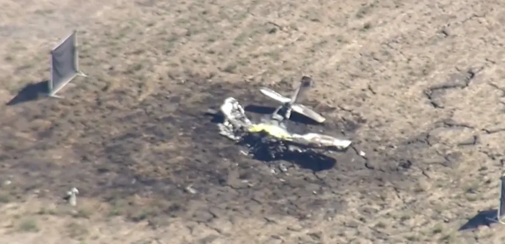 Aerial view of the wreckage of a small plane crash at Rooster Run Golf Course.