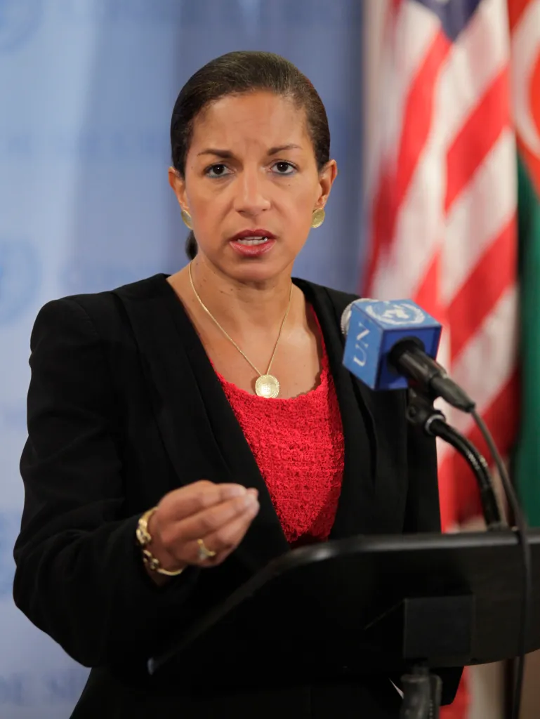 Susan Rice speaking at a podium with a microphone.