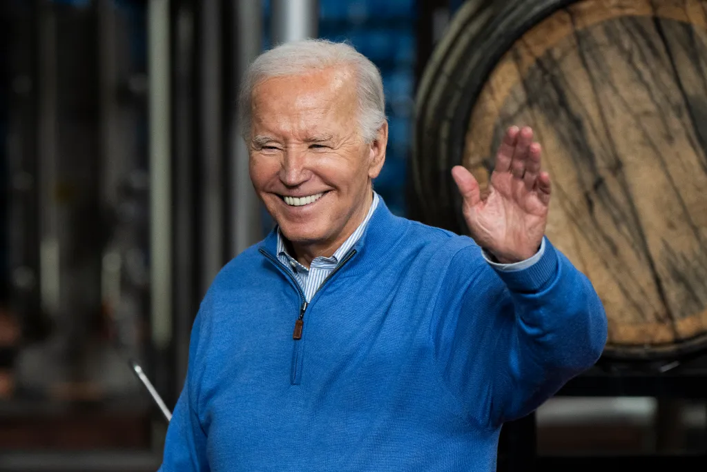 U.S. President Joe Biden waves to the audience.