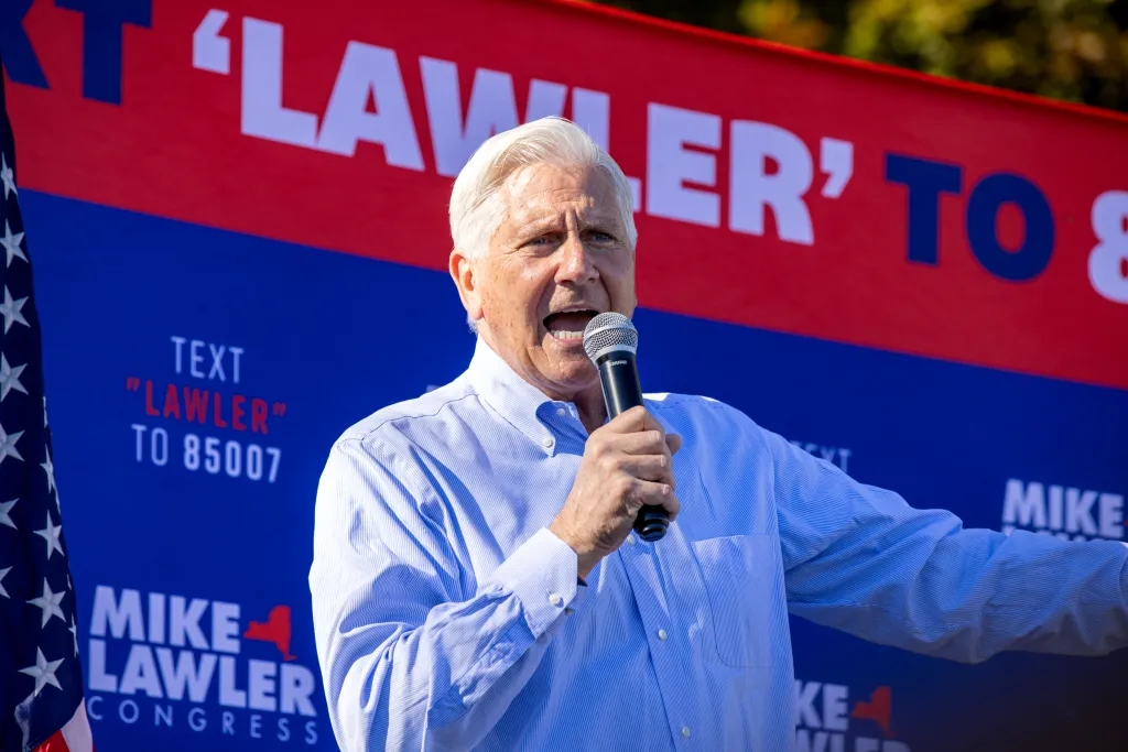 United States Congressman Mike Lawler speaks into a microphone at a Get Out The Vote Rally.