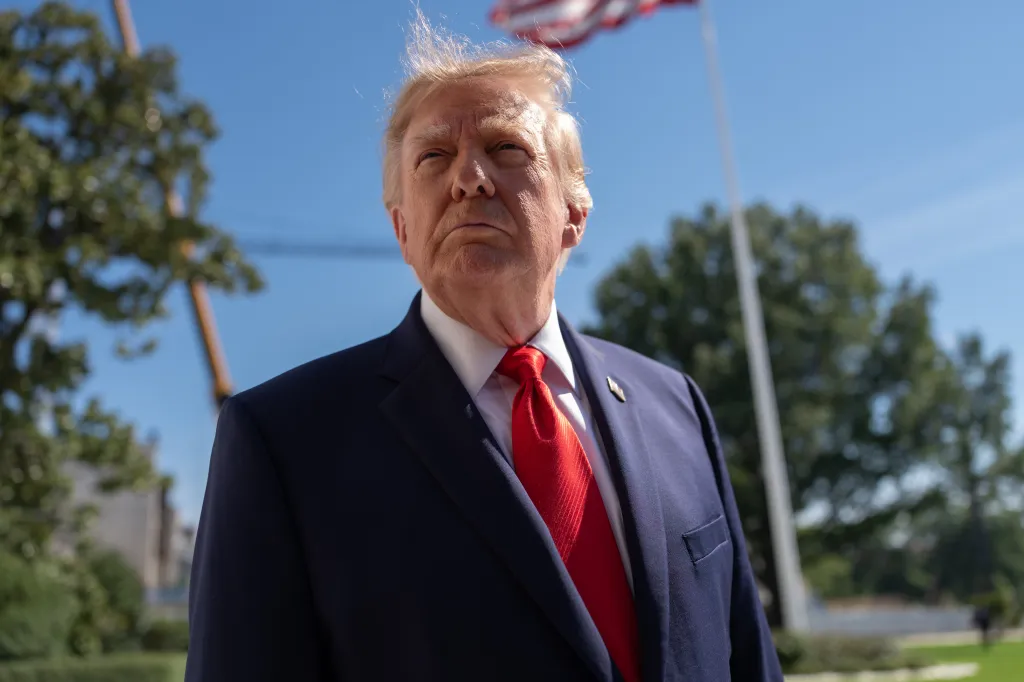 US President Donald Trump speaks to media on the South Lawn of the White House before boarding Marine One in Washington.