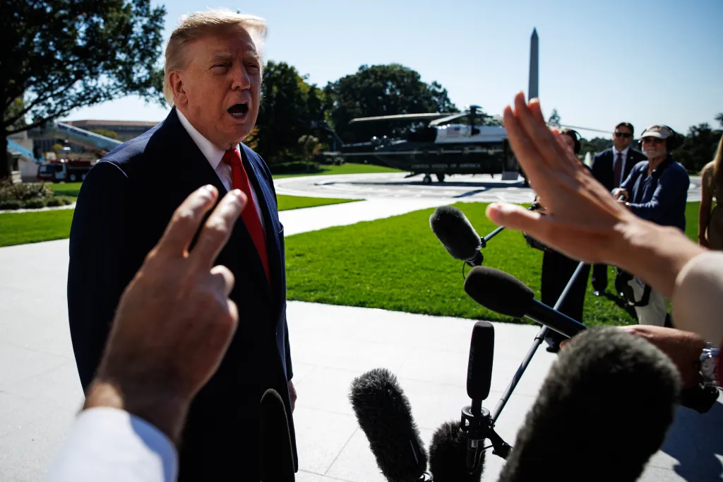 President Donald Trump speaks to reporters on the South Lawn of the White House.