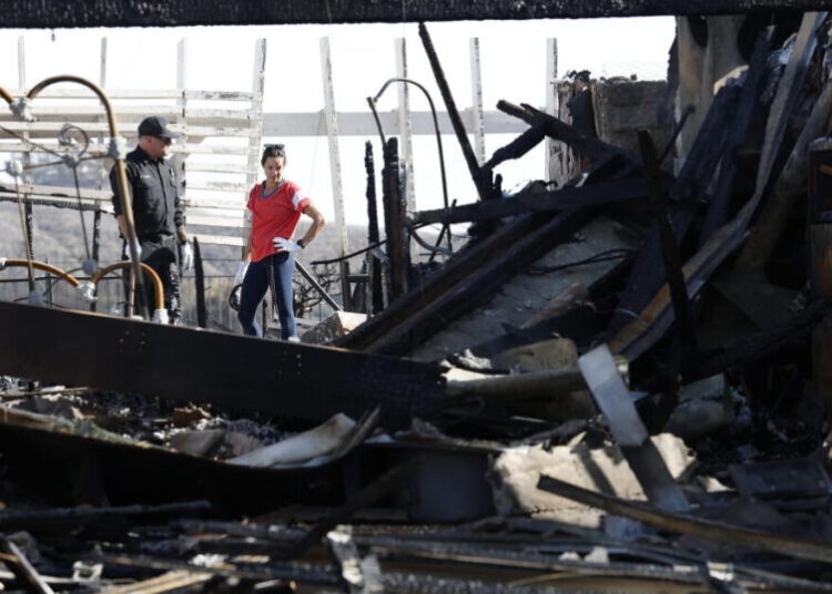 Southern California fires ease as Santa Ana winds die down. But rain could bring new risks