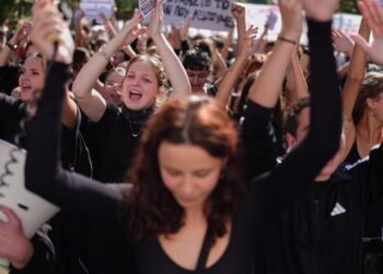 Thousands of students and teachers march through Greek capital to protest high cost of living