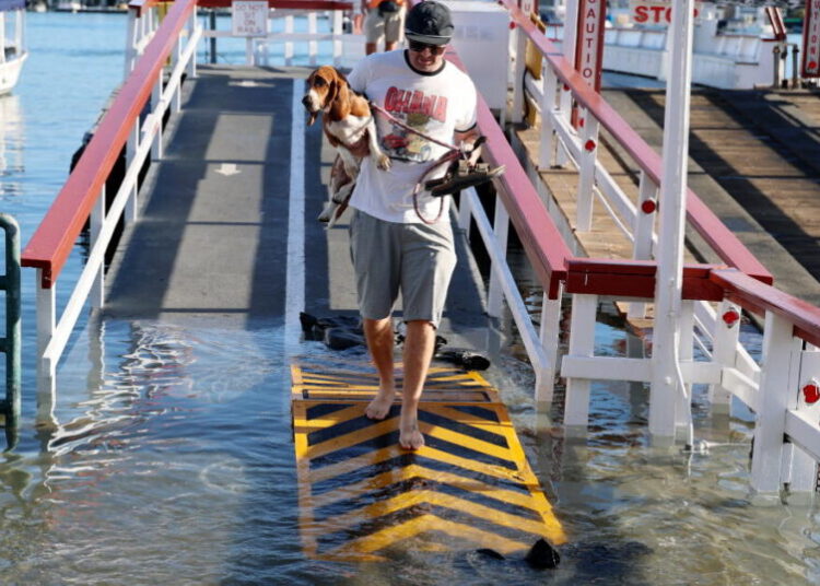 El Niño flooding grips Newport Beach in a vise. ‘Mother Nature comes to collect some tax’