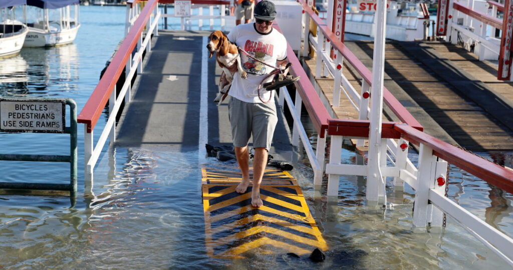 El Niño flooding grips Newport Beach in a vise. ‘Mother Nature comes to collect some tax’