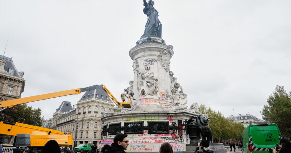 Thousands gather in Paris after a court lifts a protest ban despite fears of new violence
