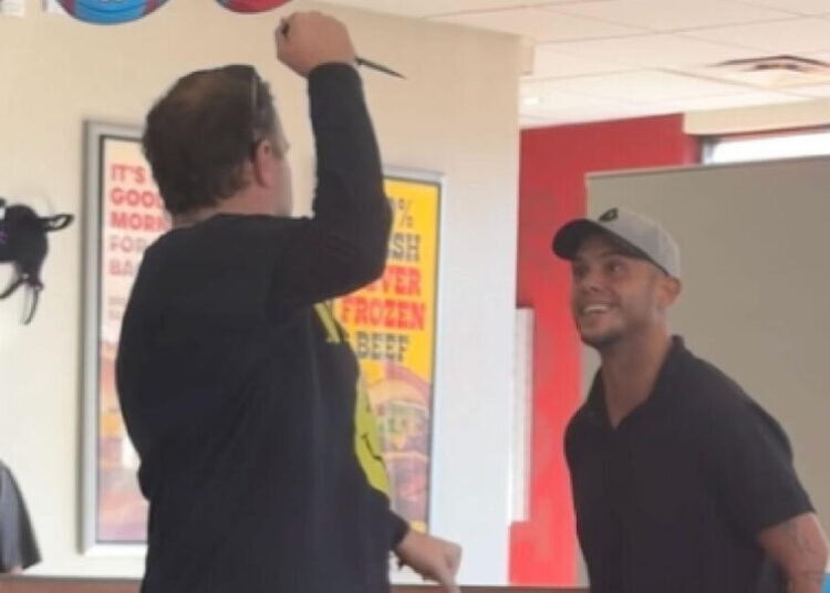 A man with a knife and another one with a grin. Wendy’s encounter goes viral