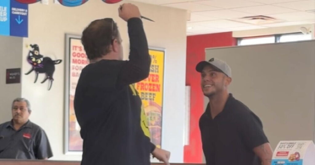 A man with a knife and another one with a grin. Wendy’s encounter goes viral