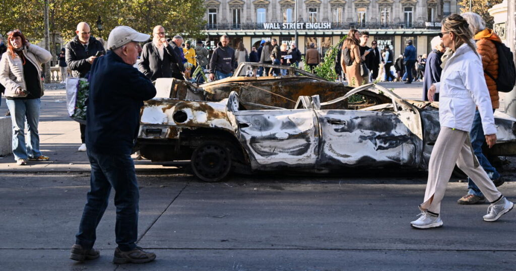 French police arrest 1,800 after violent clashes and looting mar protests