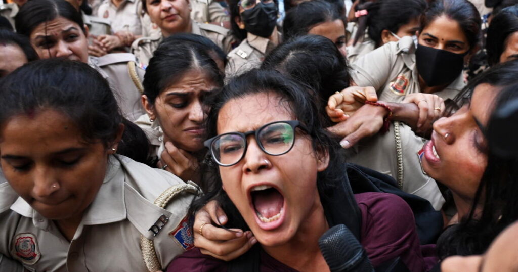 Crowds throng New Delhi and wave Indian flags amid escalating protests