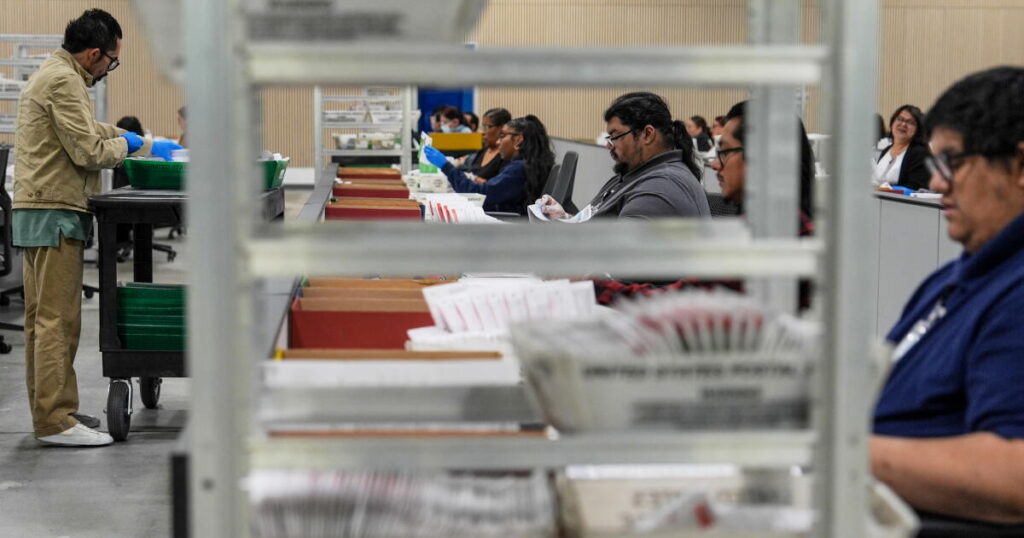 Justice Department can’t threaten election workers to stop processing ballots, judge rules