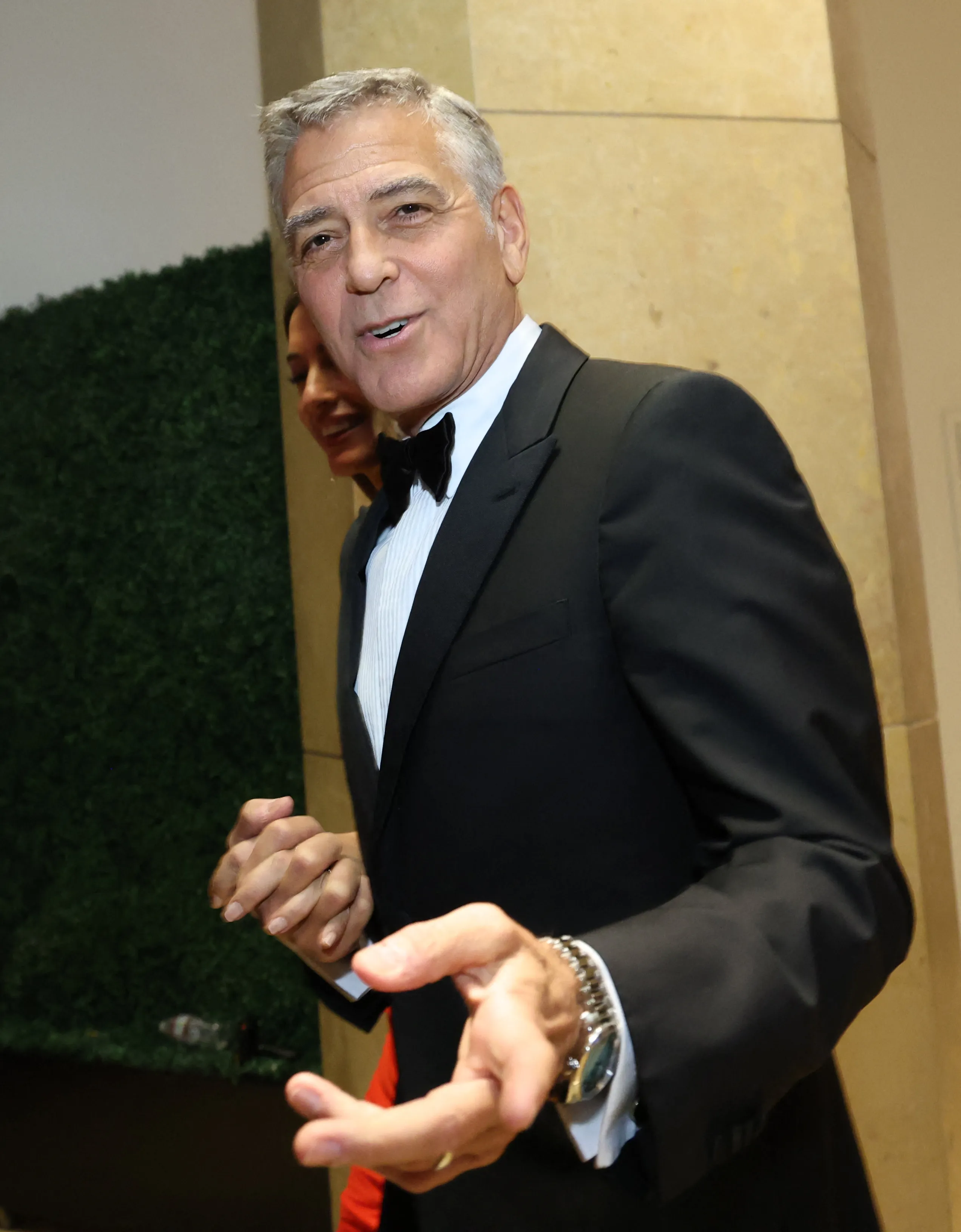 Actor George Clooney in a tuxedo with a bow tie.