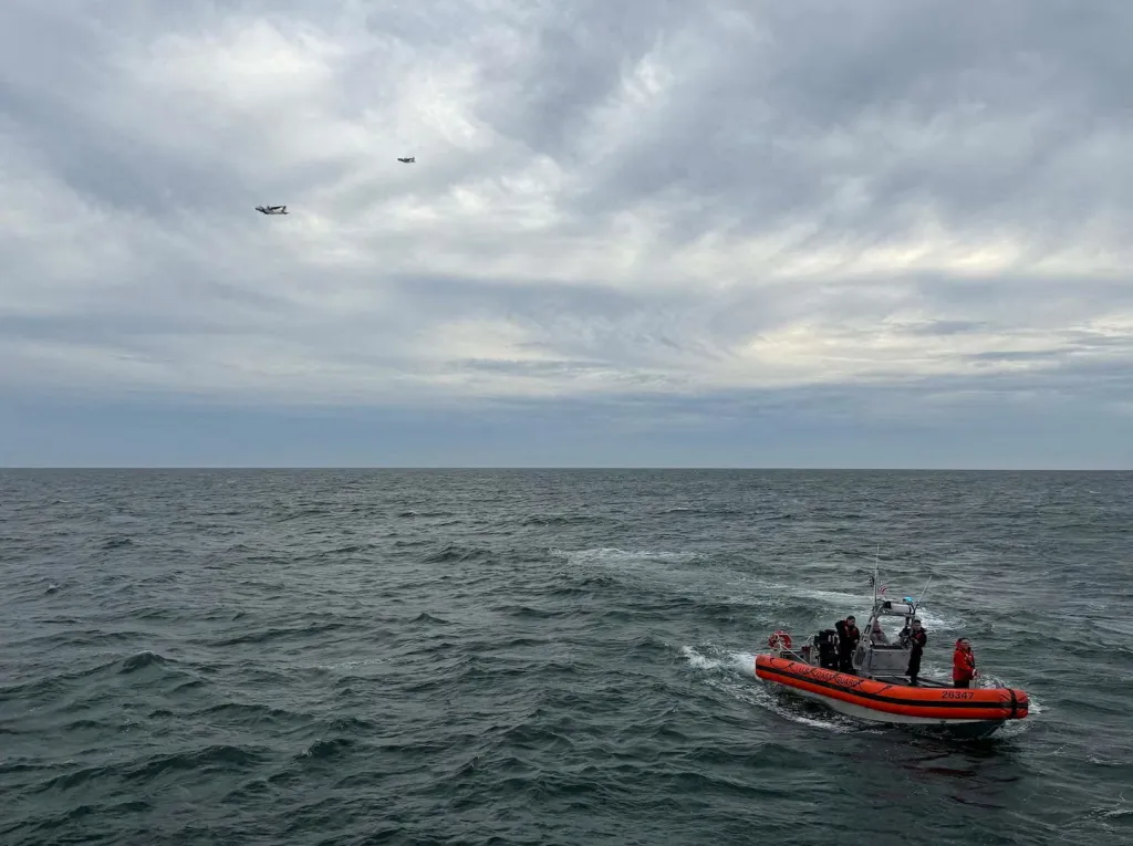 US Coast Guard members search for people after finding debris from a medical transport aircraft off the shore of Nantucket, Mass. on Oct. 4, 2026.