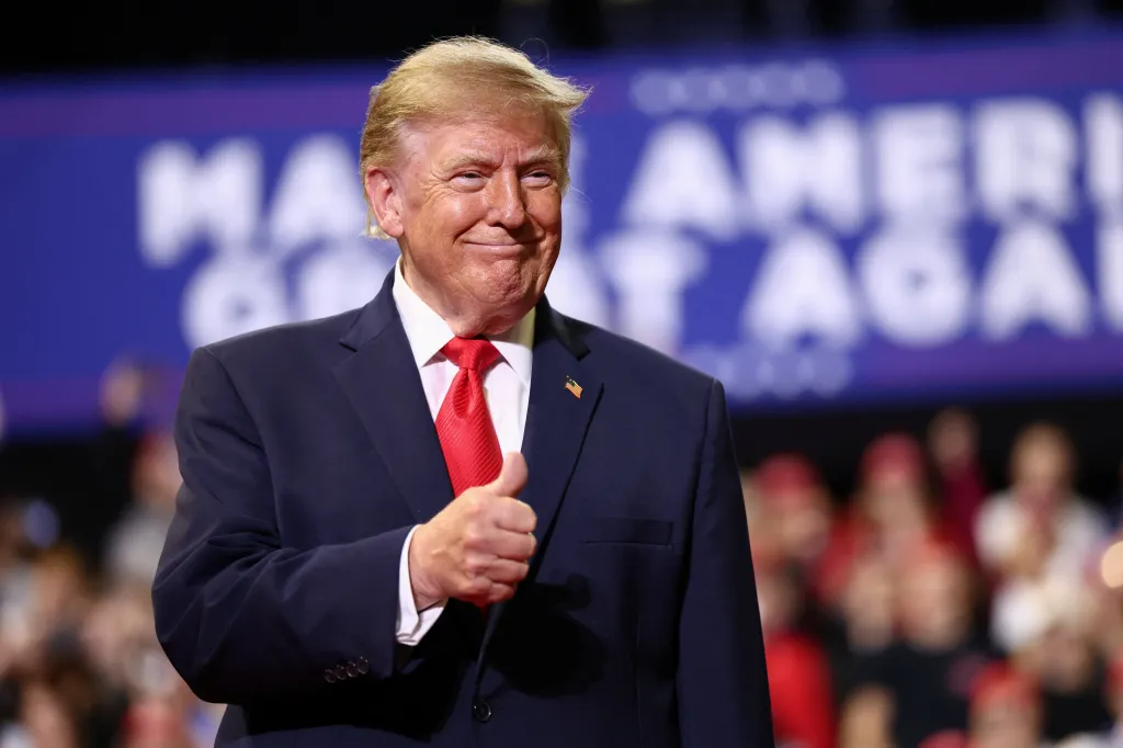U.S. President Donald Trump gestures with a thumbs-up during a campaign rally.