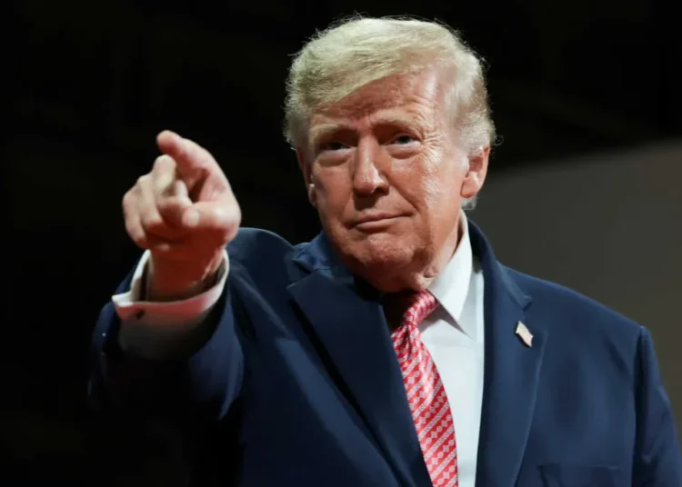 Trump repeatedly interrupted by protesters amid election screed in Kansas