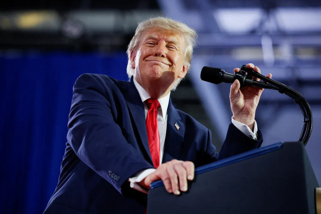 US President Donald Trump reacts on stage during a Republican campaign rally in Sioux City, Iowa.