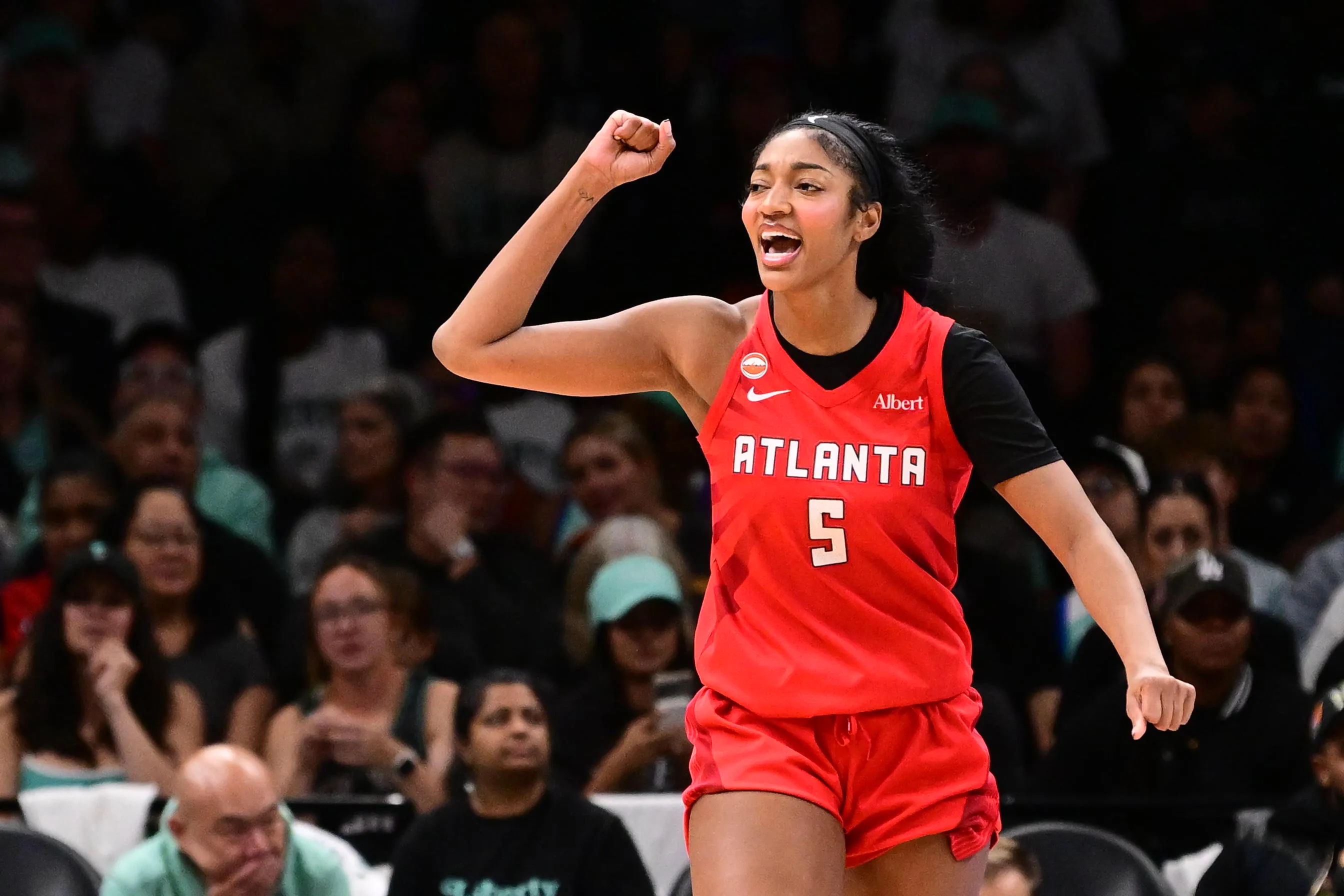 Angel Reese #5 of the Atlanta Dream celebrates during a game against the New York Liberty.
