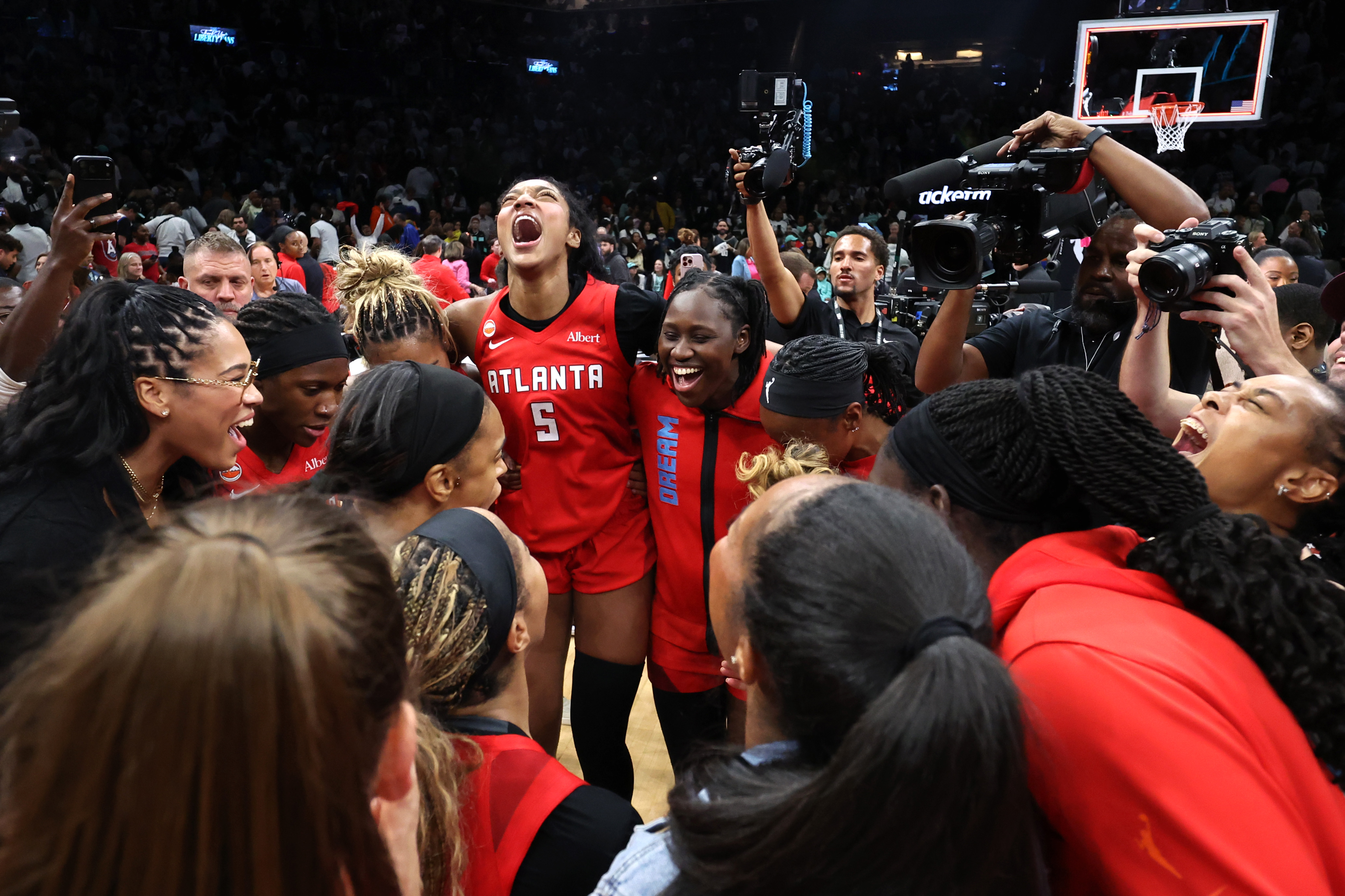 The Atlanta Dream celebrate after defeating the New York Liberty in game three of the SemiFinals of the WNBA Playoffs.