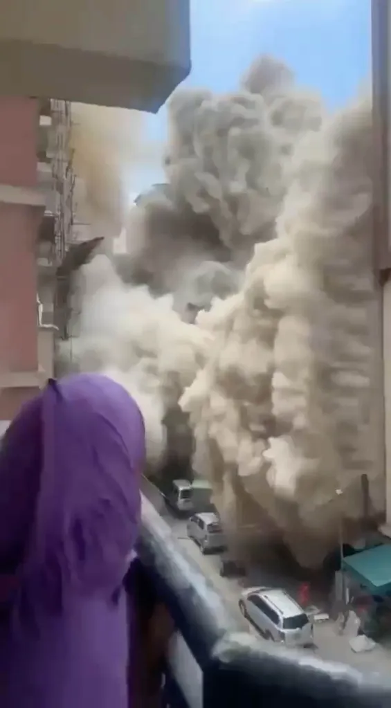 An 18-story building under construction collapses, sending up a massive cloud of dust and debris in a Nairobi suburb.