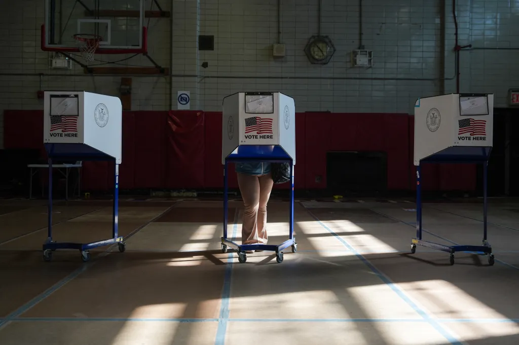 A voter casts a ballot at a polling station in New York City.