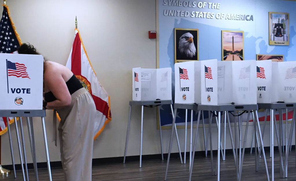 A woman fills out her ballot at a polling station in Eatonville, Florida.