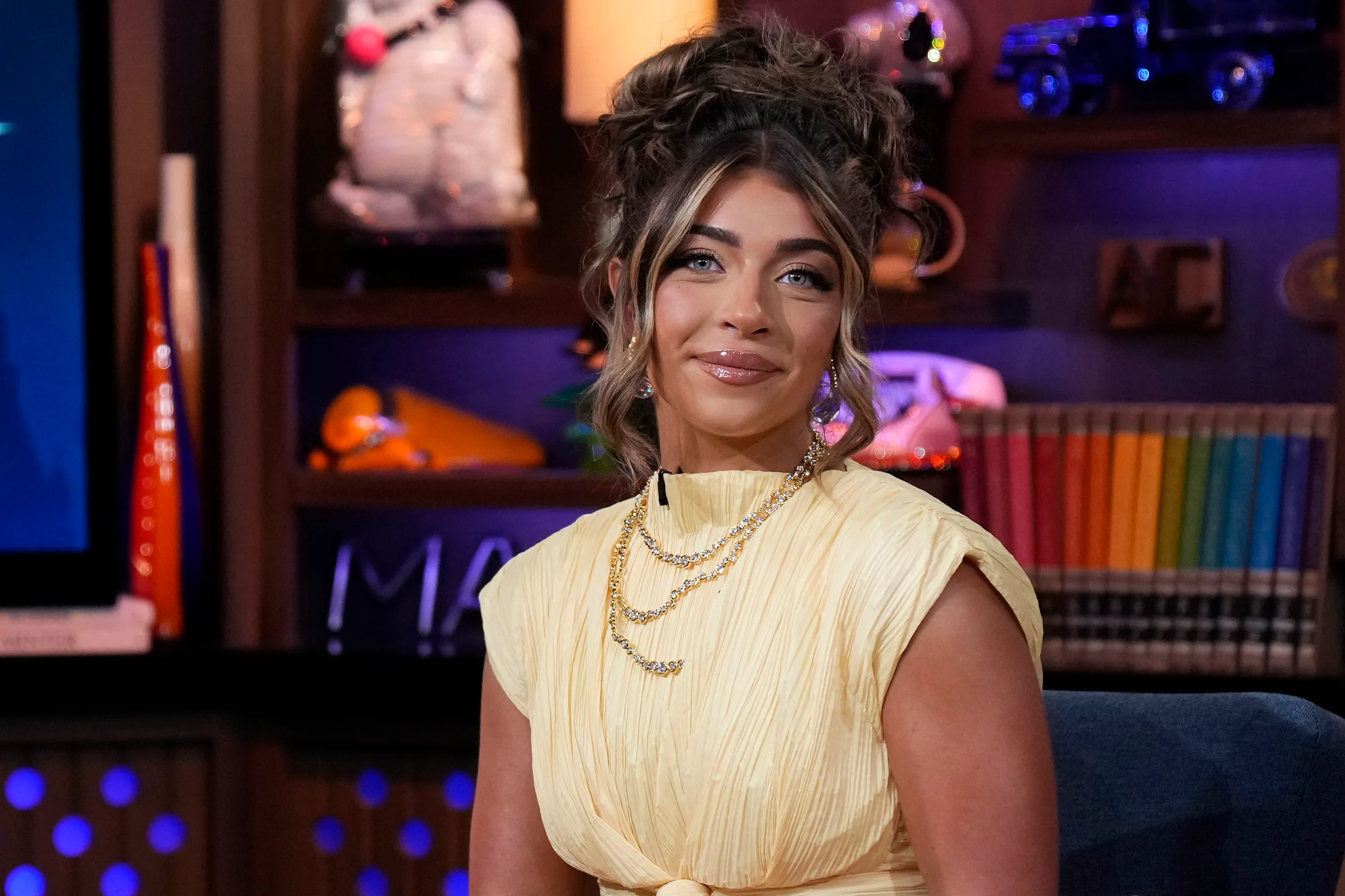 Gia Giudice wearing a yellow dress on Watch What Happens Live with Andy Cohen.