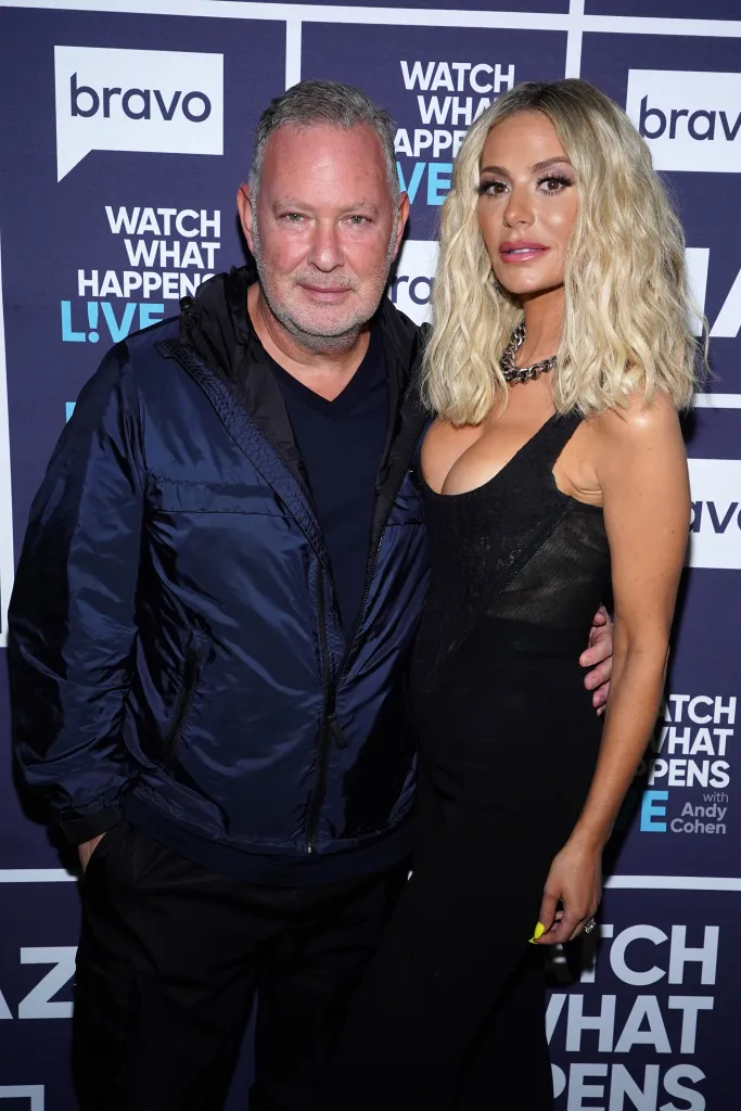 P.K. Kemsley and Dorit Kemsley pose together in front of a Watch What Happens Live backdrop.