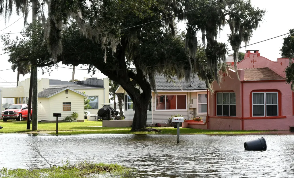 Water from the Halifax River floods a residential street in Volusia County, Florida, resulting from severe king tides, rough seas, and rain.