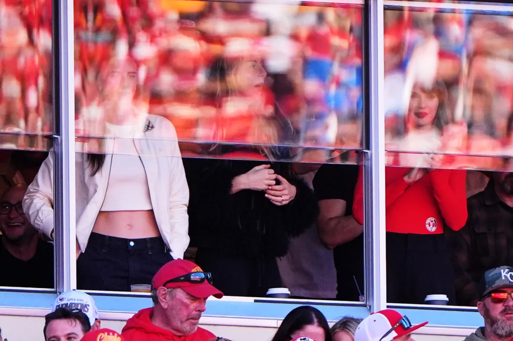 WNBA player Caitlin Clark and Taylor Swift watch a football game from a suite.