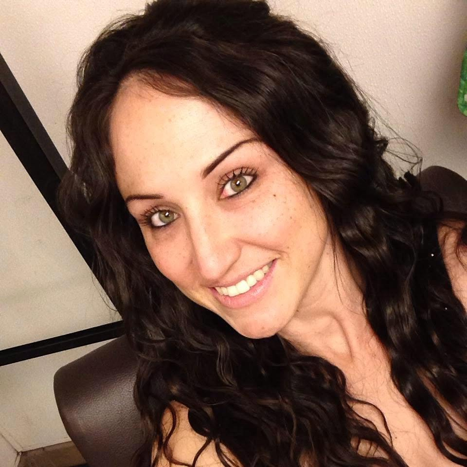 Portrait of Amber Siyavus smiling at the camera.